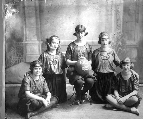 Five girls in basketball uniforms