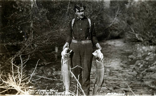 A man holds a large fish